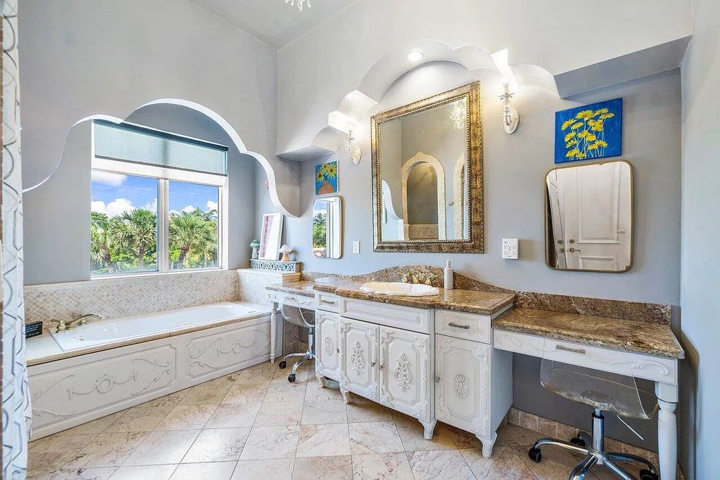 Introducing a stunning house at 14 E Ocean Avenue, located in the highly sought-after area of Boynton Beach, Florida. This luxurious property boasts 6 spacious bedrooms and 7 modern bathrooms, perfect for accommodating large families or hosting guests.