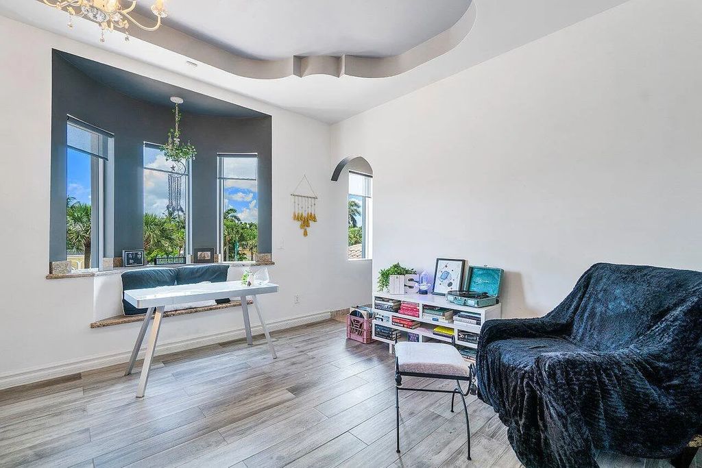 Introducing a stunning house at 14 E Ocean Avenue, located in the highly sought-after area of Boynton Beach, Florida. This luxurious property boasts 6 spacious bedrooms and 7 modern bathrooms, perfect for accommodating large families or hosting guests.