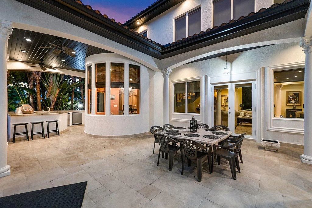 Introducing a stunning house at 14 E Ocean Avenue, located in the highly sought-after area of Boynton Beach, Florida. This luxurious property boasts 6 spacious bedrooms and 7 modern bathrooms, perfect for accommodating large families or hosting guests.