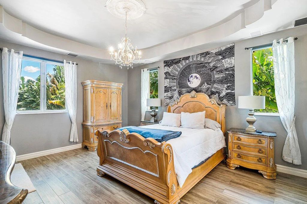 Introducing a stunning house at 14 E Ocean Avenue, located in the highly sought-after area of Boynton Beach, Florida. This luxurious property boasts 6 spacious bedrooms and 7 modern bathrooms, perfect for accommodating large families or hosting guests.