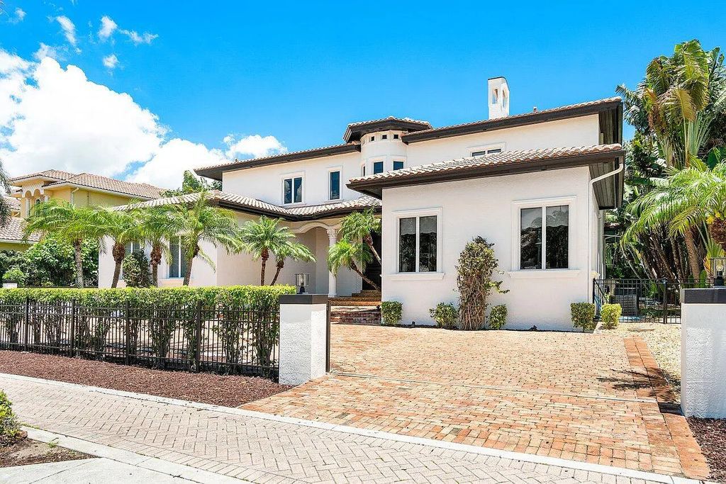 Introducing a stunning house at 14 E Ocean Avenue, located in the highly sought-after area of Boynton Beach, Florida. This luxurious property boasts 6 spacious bedrooms and 7 modern bathrooms, perfect for accommodating large families or hosting guests.