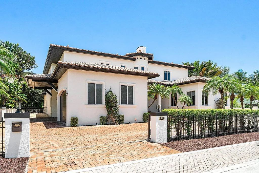 Introducing a stunning house at 14 E Ocean Avenue, located in the highly sought-after area of Boynton Beach, Florida. This luxurious property boasts 6 spacious bedrooms and 7 modern bathrooms, perfect for accommodating large families or hosting guests.