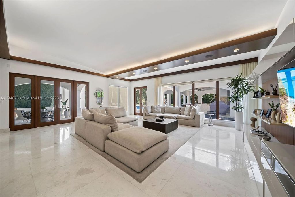Welcome to 8955 SW 63rd Court in Pinecrest, Florida - an opulent oasis in the sought-after Stritter Estates community. This stunning 6-bedroom, 10-bathroom home boasts over 7,700 square feet of luxurious living space, situated on a sprawling 0.87-acre lot. Built in 2013, this home in Pinecrest is as functional as it is beautiful.