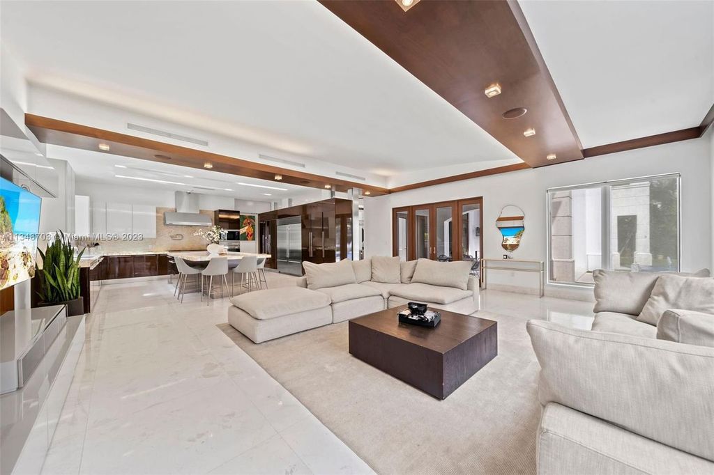 Welcome to 8955 SW 63rd Court in Pinecrest, Florida - an opulent oasis in the sought-after Stritter Estates community. This stunning 6-bedroom, 10-bathroom home boasts over 7,700 square feet of luxurious living space, situated on a sprawling 0.87-acre lot. Built in 2013, this home in Pinecrest is as functional as it is beautiful.