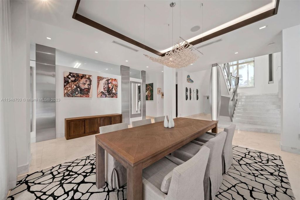 Welcome to 8955 SW 63rd Court in Pinecrest, Florida - an opulent oasis in the sought-after Stritter Estates community. This stunning 6-bedroom, 10-bathroom home boasts over 7,700 square feet of luxurious living space, situated on a sprawling 0.87-acre lot. Built in 2013, this home in Pinecrest is as functional as it is beautiful.