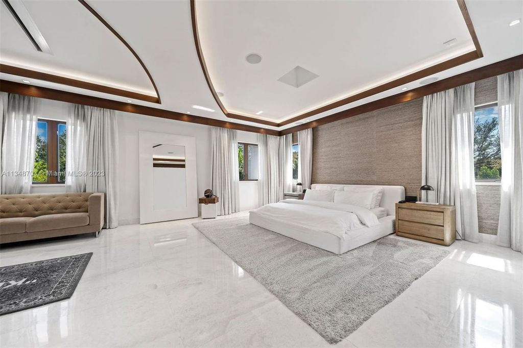 Welcome to 8955 SW 63rd Court in Pinecrest, Florida - an opulent oasis in the sought-after Stritter Estates community. This stunning 6-bedroom, 10-bathroom home boasts over 7,700 square feet of luxurious living space, situated on a sprawling 0.87-acre lot. Built in 2013, this home in Pinecrest is as functional as it is beautiful.