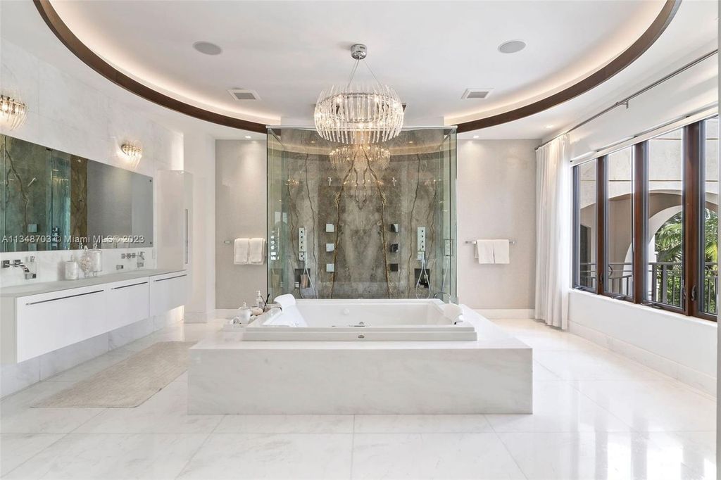 Welcome to 8955 SW 63rd Court in Pinecrest, Florida - an opulent oasis in the sought-after Stritter Estates community. This stunning 6-bedroom, 10-bathroom home boasts over 7,700 square feet of luxurious living space, situated on a sprawling 0.87-acre lot. Built in 2013, this home in Pinecrest is as functional as it is beautiful.