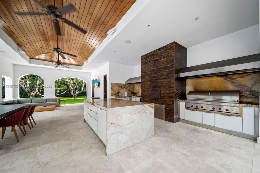 Welcome to 8955 SW 63rd Court in Pinecrest, Florida - an opulent oasis in the sought-after Stritter Estates community. This stunning 6-bedroom, 10-bathroom home boasts over 7,700 square feet of luxurious living space, situated on a sprawling 0.87-acre lot. Built in 2013, this home in Pinecrest is as functional as it is beautiful.