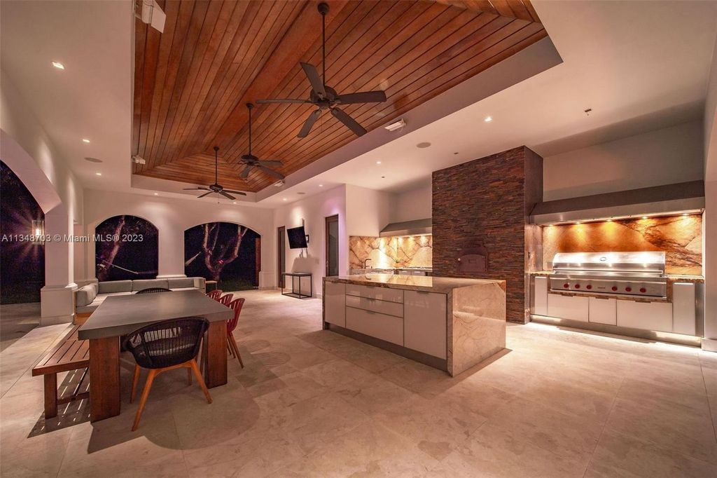 Welcome to 8955 SW 63rd Court in Pinecrest, Florida - an opulent oasis in the sought-after Stritter Estates community. This stunning 6-bedroom, 10-bathroom home boasts over 7,700 square feet of luxurious living space, situated on a sprawling 0.87-acre lot. Built in 2013, this home in Pinecrest is as functional as it is beautiful.