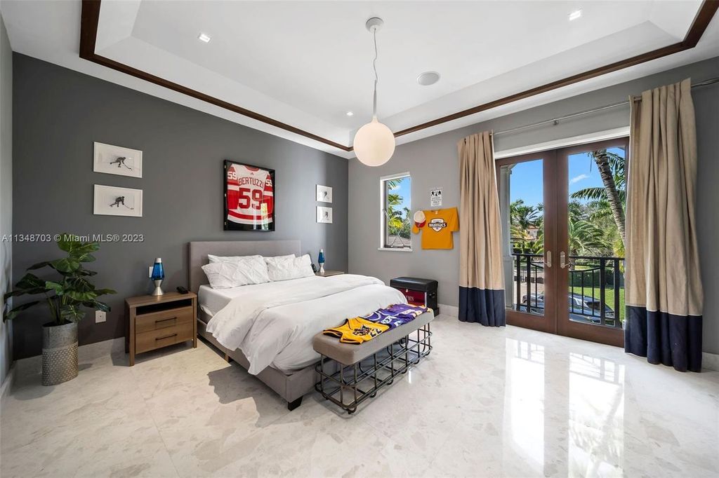 Welcome to 8955 SW 63rd Court in Pinecrest, Florida - an opulent oasis in the sought-after Stritter Estates community. This stunning 6-bedroom, 10-bathroom home boasts over 7,700 square feet of luxurious living space, situated on a sprawling 0.87-acre lot. Built in 2013, this home in Pinecrest is as functional as it is beautiful.