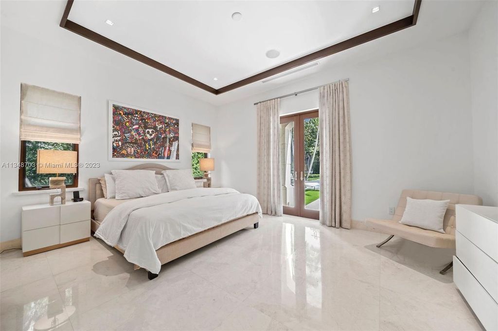Welcome to 8955 SW 63rd Court in Pinecrest, Florida - an opulent oasis in the sought-after Stritter Estates community. This stunning 6-bedroom, 10-bathroom home boasts over 7,700 square feet of luxurious living space, situated on a sprawling 0.87-acre lot. Built in 2013, this home in Pinecrest is as functional as it is beautiful.