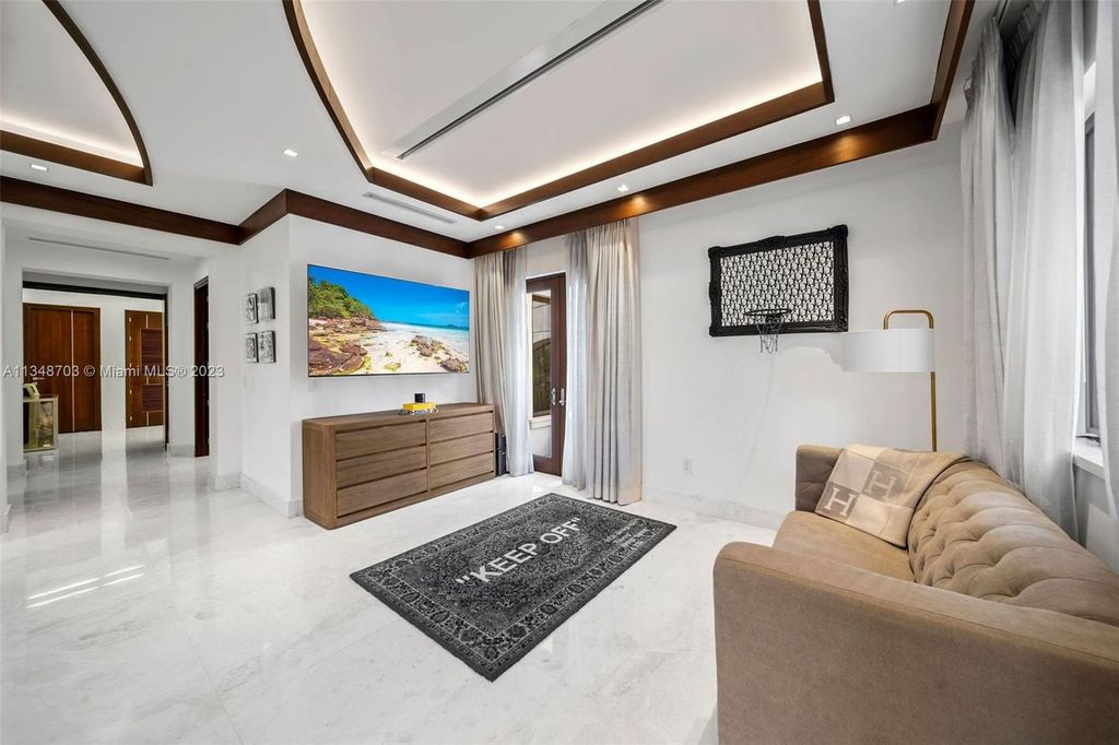 Welcome to 8955 SW 63rd Court in Pinecrest, Florida - an opulent oasis in the sought-after Stritter Estates community. This stunning 6-bedroom, 10-bathroom home boasts over 7,700 square feet of luxurious living space, situated on a sprawling 0.87-acre lot. Built in 2013, this home in Pinecrest is as functional as it is beautiful.