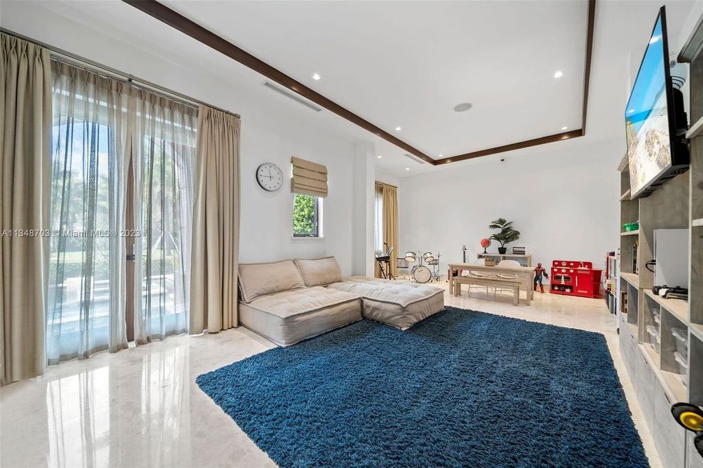 Welcome to 8955 SW 63rd Court in Pinecrest, Florida - an opulent oasis in the sought-after Stritter Estates community. This stunning 6-bedroom, 10-bathroom home boasts over 7,700 square feet of luxurious living space, situated on a sprawling 0.87-acre lot. Built in 2013, this home in Pinecrest is as functional as it is beautiful.