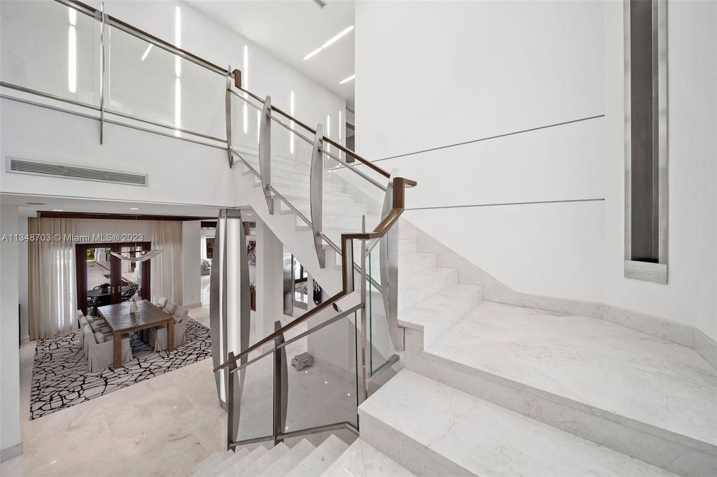 Welcome to 8955 SW 63rd Court in Pinecrest, Florida - an opulent oasis in the sought-after Stritter Estates community. This stunning 6-bedroom, 10-bathroom home boasts over 7,700 square feet of luxurious living space, situated on a sprawling 0.87-acre lot. Built in 2013, this home in Pinecrest is as functional as it is beautiful.