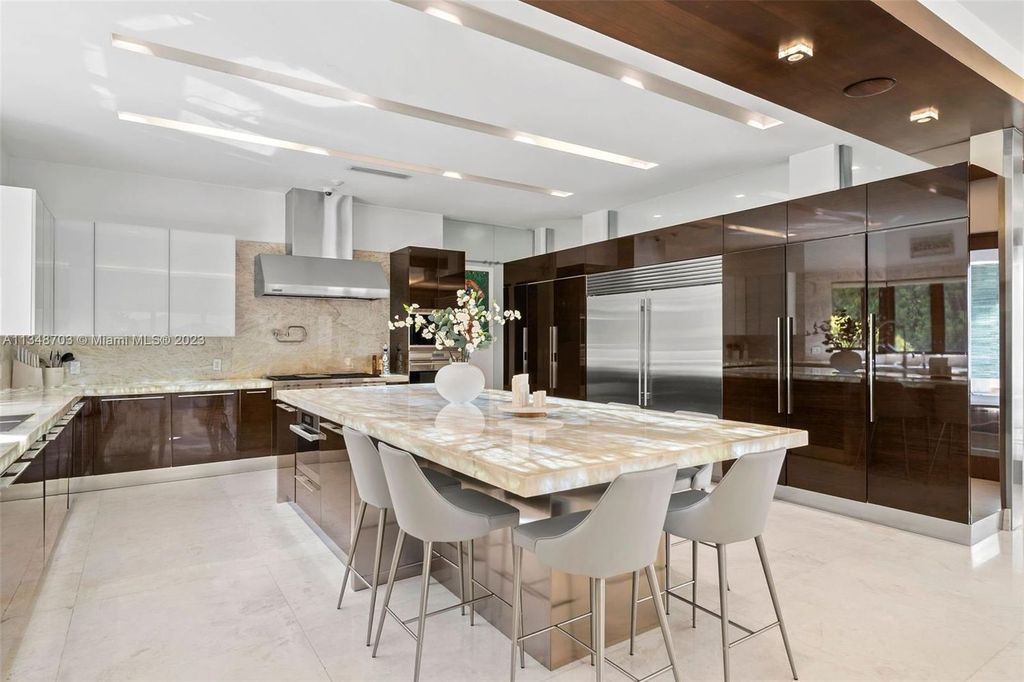 Welcome to 8955 SW 63rd Court in Pinecrest, Florida - an opulent oasis in the sought-after Stritter Estates community. This stunning 6-bedroom, 10-bathroom home boasts over 7,700 square feet of luxurious living space, situated on a sprawling 0.87-acre lot. Built in 2013, this home in Pinecrest is as functional as it is beautiful.