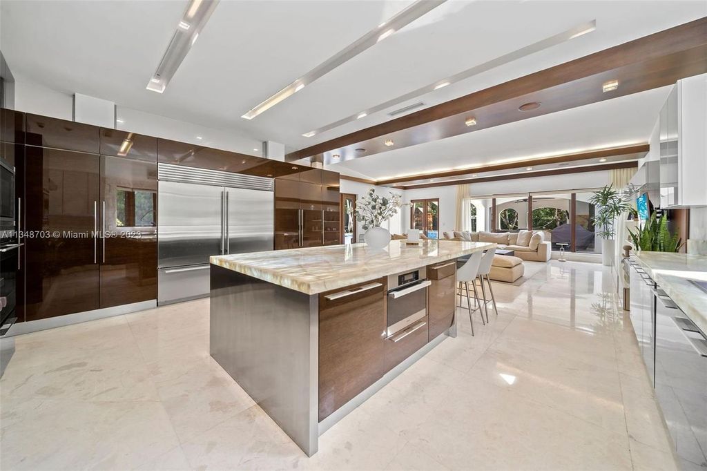 Welcome to 8955 SW 63rd Court in Pinecrest, Florida - an opulent oasis in the sought-after Stritter Estates community. This stunning 6-bedroom, 10-bathroom home boasts over 7,700 square feet of luxurious living space, situated on a sprawling 0.87-acre lot. Built in 2013, this home in Pinecrest is as functional as it is beautiful.