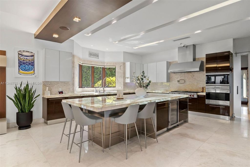 Welcome to 8955 SW 63rd Court in Pinecrest, Florida - an opulent oasis in the sought-after Stritter Estates community. This stunning 6-bedroom, 10-bathroom home boasts over 7,700 square feet of luxurious living space, situated on a sprawling 0.87-acre lot. Built in 2013, this home in Pinecrest is as functional as it is beautiful.