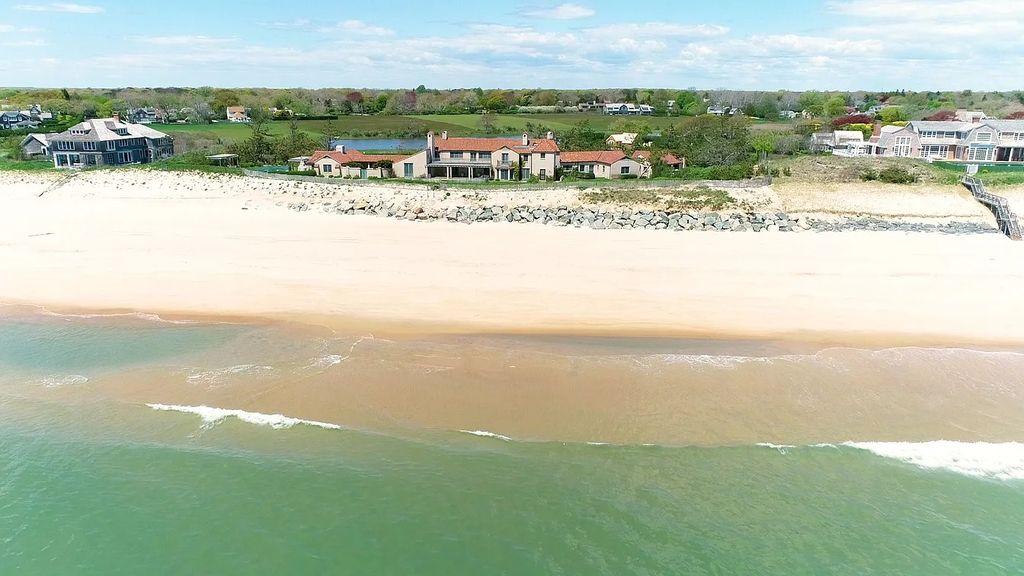 The House in East Hampton includes oceanside pool, extensive terraces and second floor deck taking full advantage of the panoramic views now available for sale. This home located at 201 Lily Pond Ln, East Hampton, New York