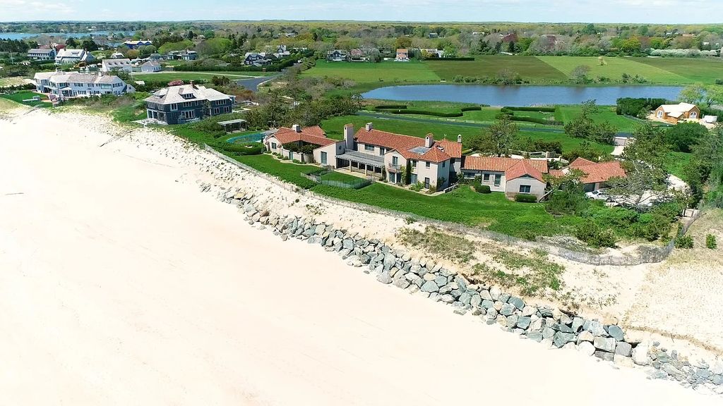 The House in East Hampton includes oceanside pool, extensive terraces and second floor deck taking full advantage of the panoramic views now available for sale. This home located at 201 Lily Pond Ln, East Hampton, New York