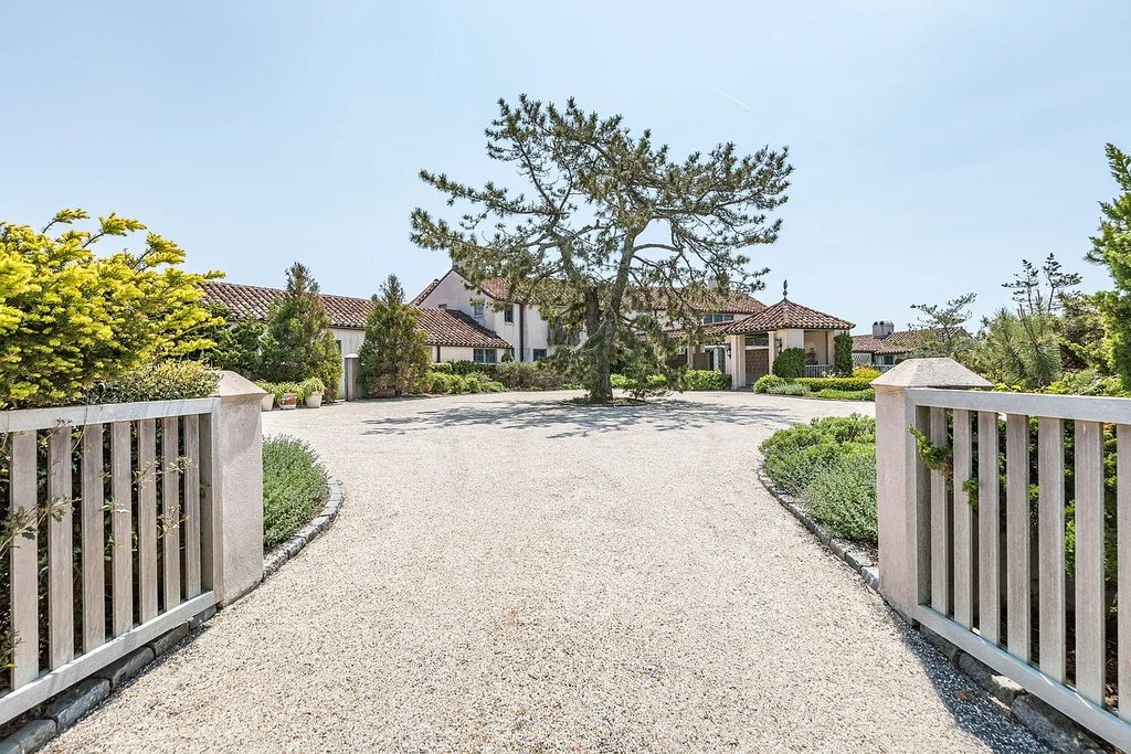 The House in East Hampton includes oceanside pool, extensive terraces and second floor deck taking full advantage of the panoramic views now available for sale. This home located at 201 Lily Pond Ln, East Hampton, New York
