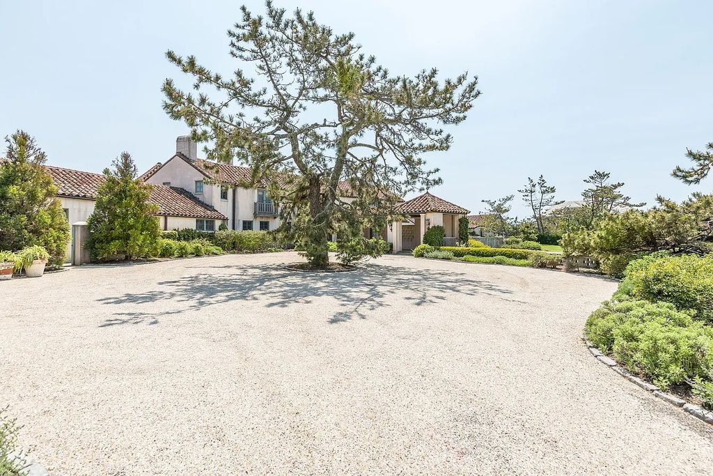 The House in East Hampton includes oceanside pool, extensive terraces and second floor deck taking full advantage of the panoramic views now available for sale. This home located at 201 Lily Pond Ln, East Hampton, New York