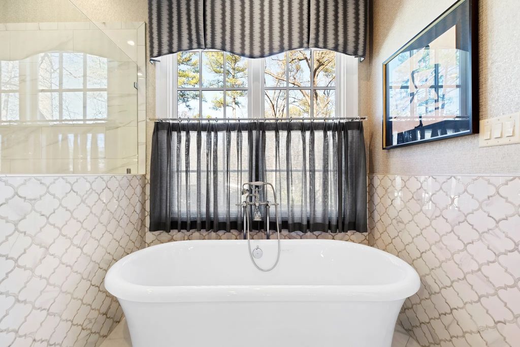 The House in Raleigh has large, beautifully landscaped back yard includes privacy fence, slate patio, and wood-burning fireplace with sitting area, now available for sale. This home located at 3910 Stratford Ct, Raleigh, North Carolina
