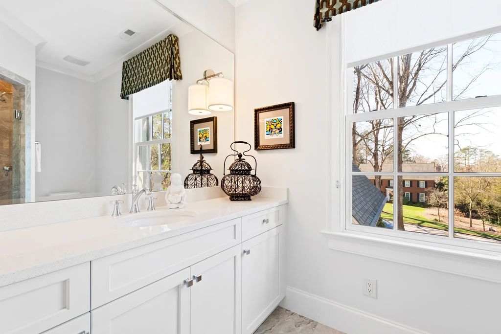 The House in Raleigh has large, beautifully landscaped back yard includes privacy fence, slate patio, and wood-burning fireplace with sitting area, now available for sale. This home located at 3910 Stratford Ct, Raleigh, North Carolina