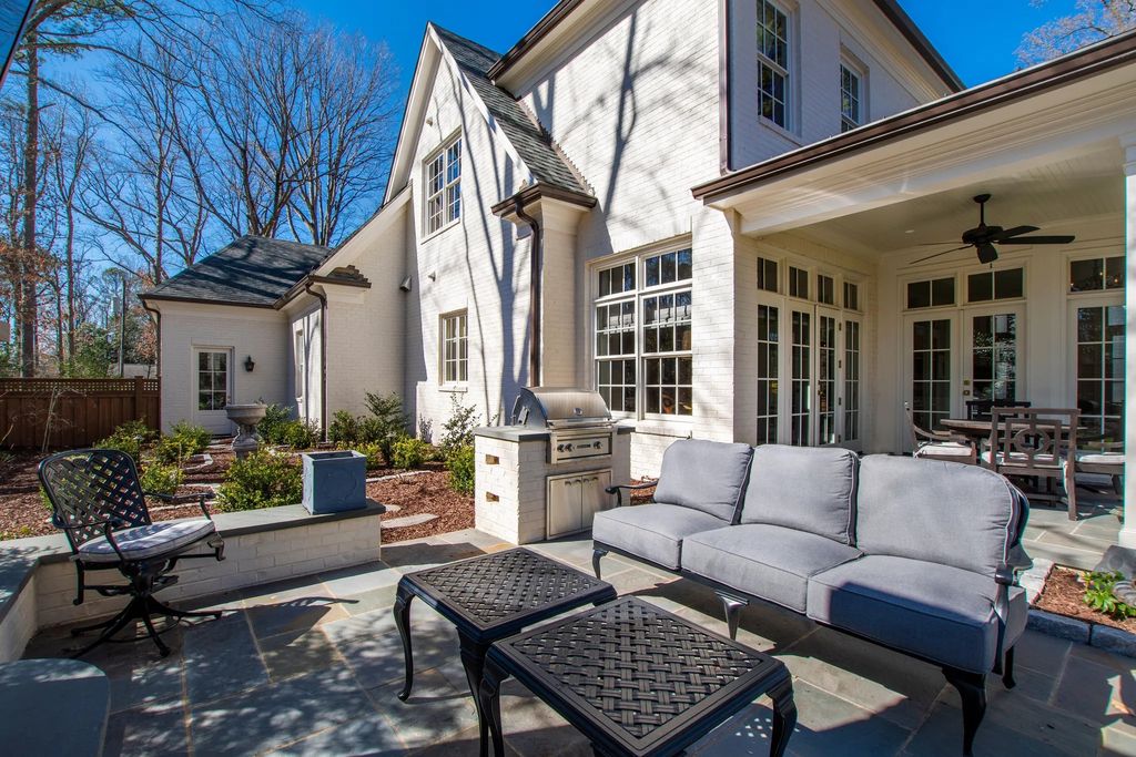The House in Raleigh has large, beautifully landscaped back yard includes privacy fence, slate patio, and wood-burning fireplace with sitting area, now available for sale. This home located at 3910 Stratford Ct, Raleigh, North Carolina