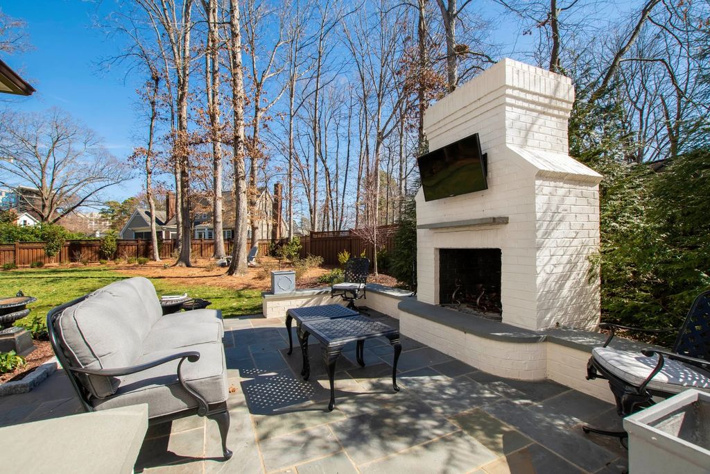 The House in Raleigh has large, beautifully landscaped back yard includes privacy fence, slate patio, and wood-burning fireplace with sitting area, now available for sale. This home located at 3910 Stratford Ct, Raleigh, North Carolina