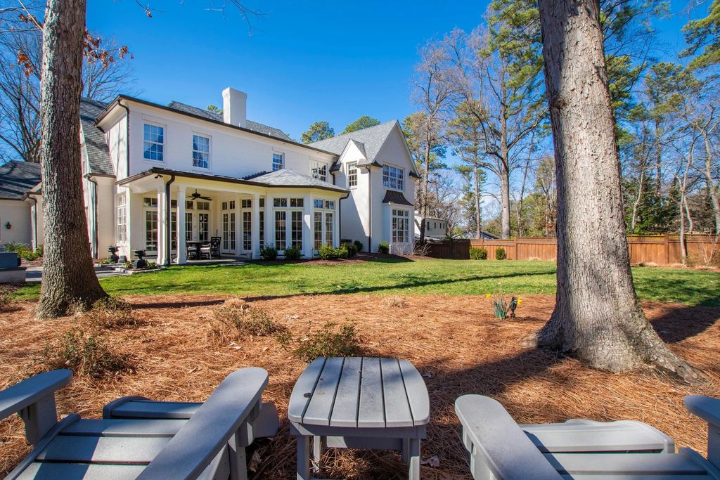 The House in Raleigh has large, beautifully landscaped back yard includes privacy fence, slate patio, and wood-burning fireplace with sitting area, now available for sale. This home located at 3910 Stratford Ct, Raleigh, North Carolina