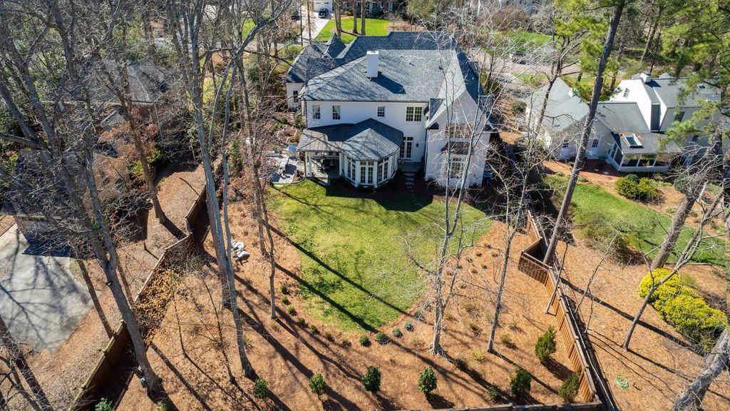The House in Raleigh has large, beautifully landscaped back yard includes privacy fence, slate patio, and wood-burning fireplace with sitting area, now available for sale. This home located at 3910 Stratford Ct, Raleigh, North Carolina