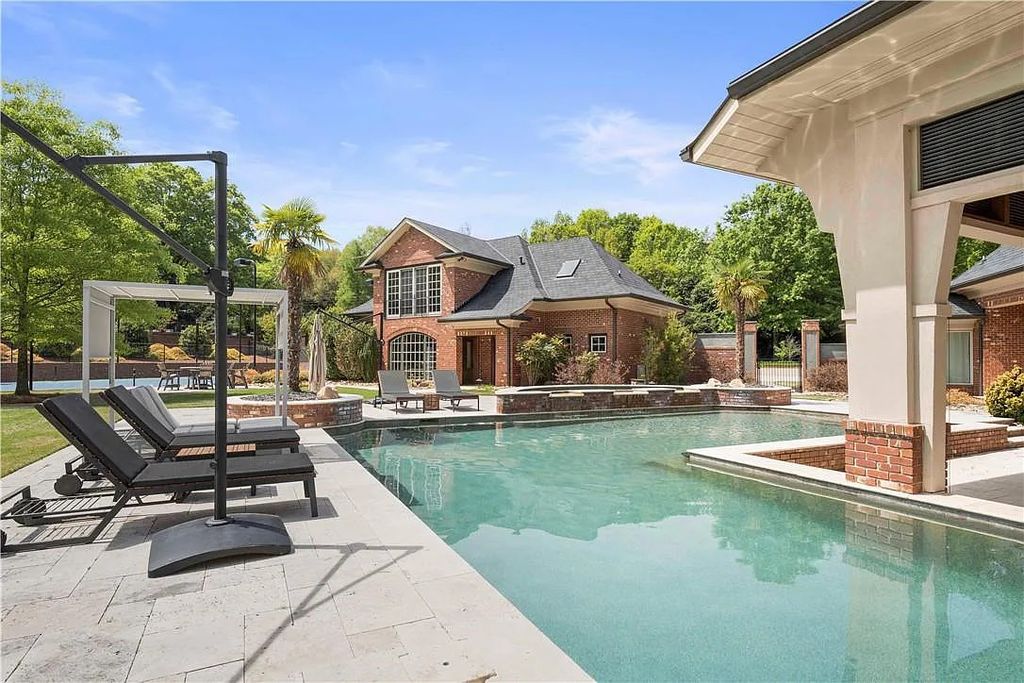 The Estate in Charlotte is a custom-built unique home designed by well-known architect Harry Schrader, now available for sale. This home located at 8402 Fairview Rd, Charlotte, North Carolina