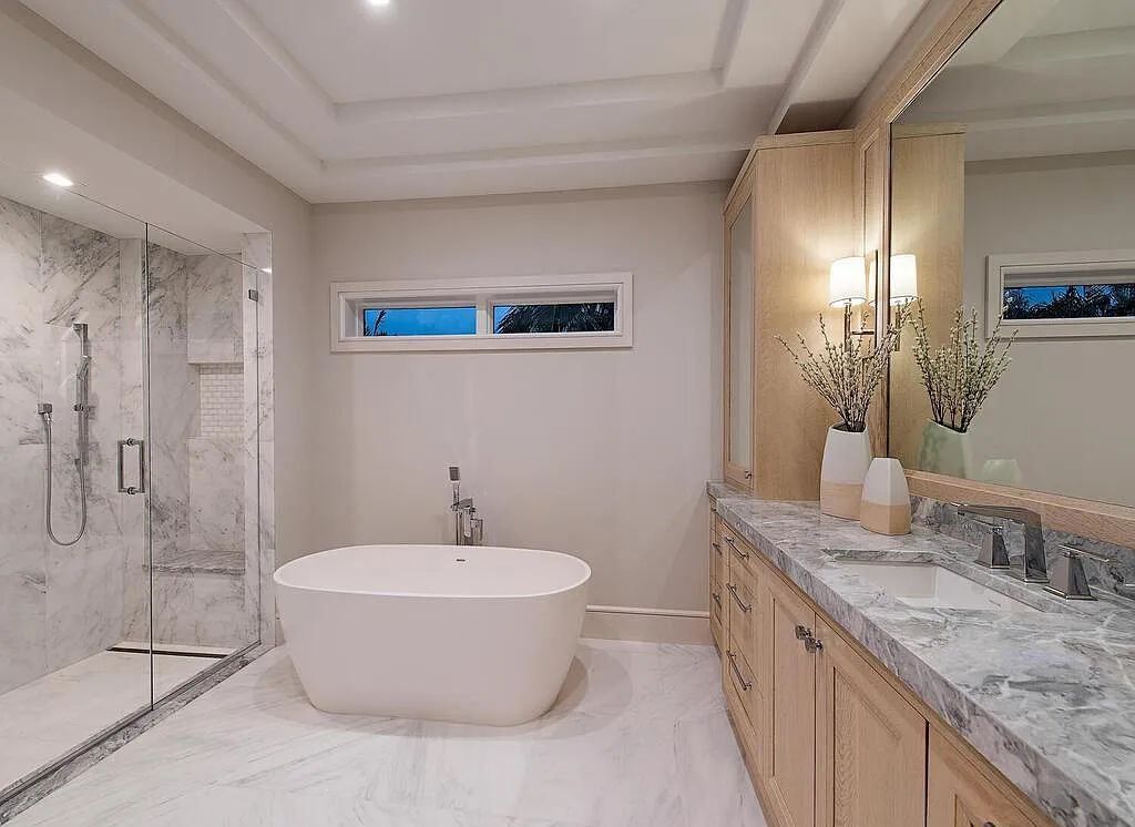 This stunning house located at 2060 Gordon Drive, Naples, Florida, is now available for sale. The newly completed residence is part of a unique, gated beachfront enclave consisting of nine homes, making it a highly coveted property.
