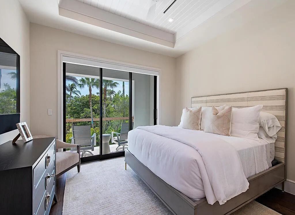 This stunning house located at 2060 Gordon Drive, Naples, Florida, is now available for sale. The newly completed residence is part of a unique, gated beachfront enclave consisting of nine homes, making it a highly coveted property.
