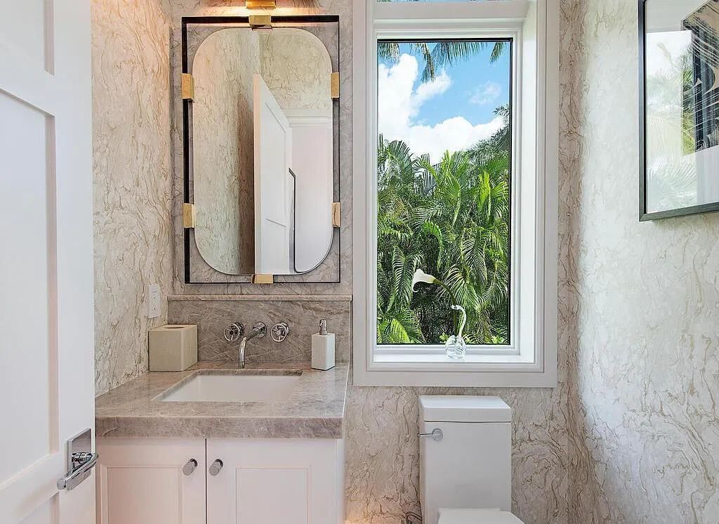 This stunning house located at 2060 Gordon Drive, Naples, Florida, is now available for sale. The newly completed residence is part of a unique, gated beachfront enclave consisting of nine homes, making it a highly coveted property.