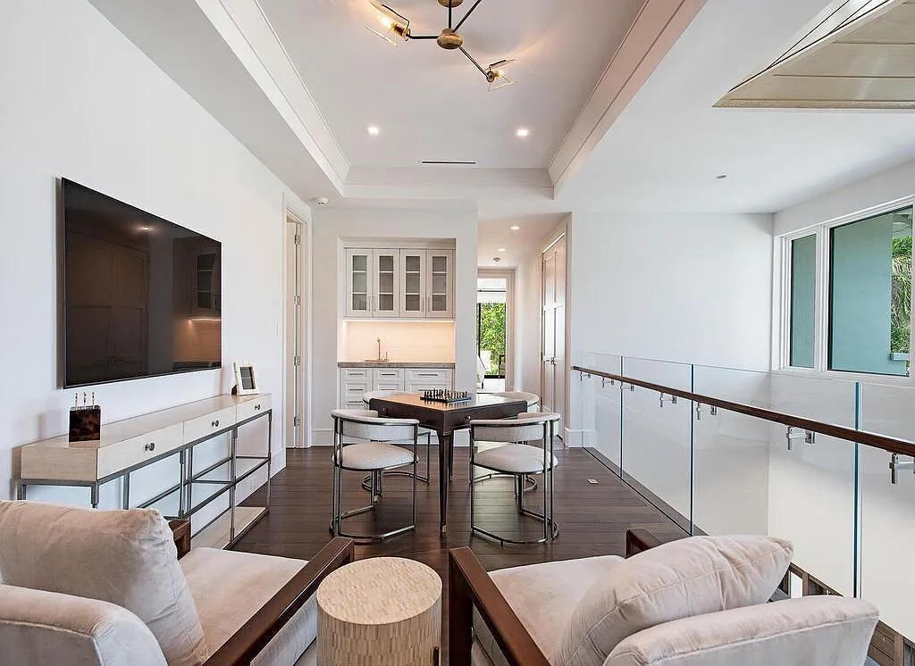 This stunning house located at 2060 Gordon Drive, Naples, Florida, is now available for sale. The newly completed residence is part of a unique, gated beachfront enclave consisting of nine homes, making it a highly coveted property.