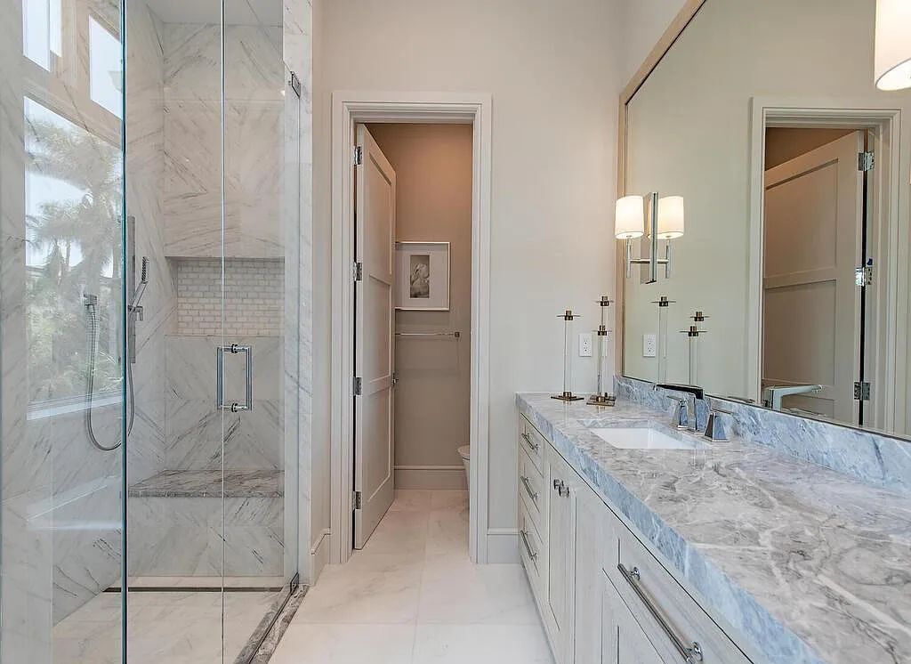 This stunning house located at 2060 Gordon Drive, Naples, Florida, is now available for sale. The newly completed residence is part of a unique, gated beachfront enclave consisting of nine homes, making it a highly coveted property.