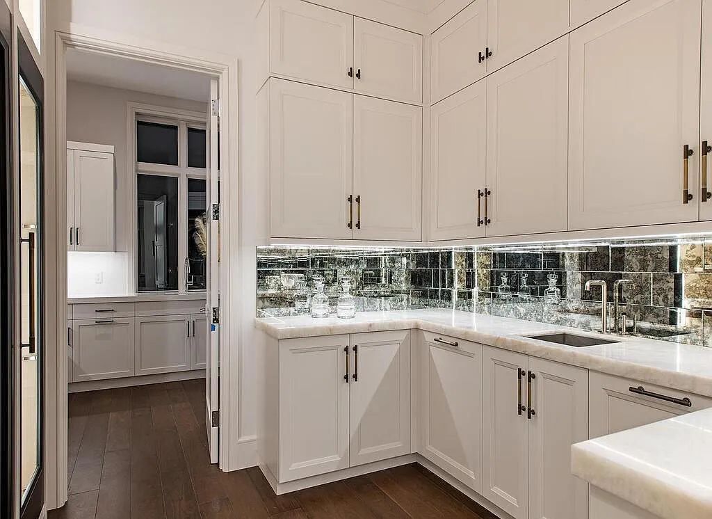 This stunning house located at 2060 Gordon Drive, Naples, Florida, is now available for sale. The newly completed residence is part of a unique, gated beachfront enclave consisting of nine homes, making it a highly coveted property.