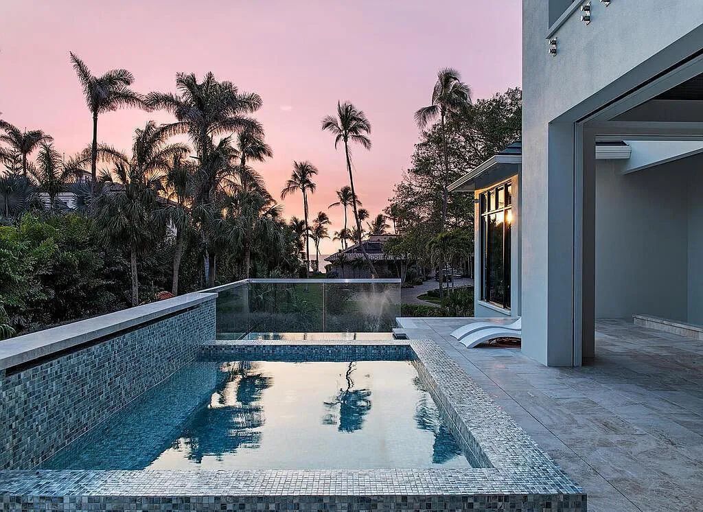 This stunning house located at 2060 Gordon Drive, Naples, Florida, is now available for sale. The newly completed residence is part of a unique, gated beachfront enclave consisting of nine homes, making it a highly coveted property.