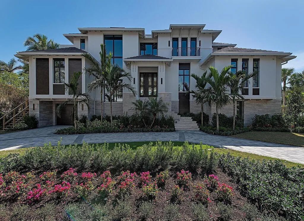This stunning house located at 2060 Gordon Drive, Naples, Florida, is now available for sale. The newly completed residence is part of a unique, gated beachfront enclave consisting of nine homes, making it a highly coveted property.