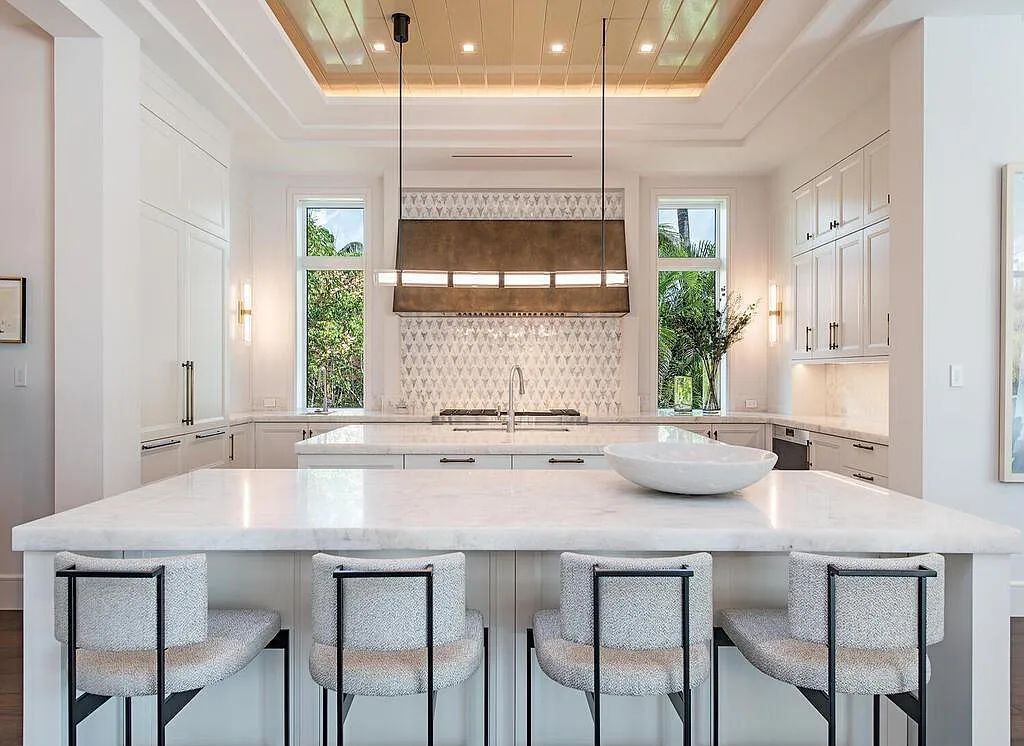 This stunning house located at 2060 Gordon Drive, Naples, Florida, is now available for sale. The newly completed residence is part of a unique, gated beachfront enclave consisting of nine homes, making it a highly coveted property.