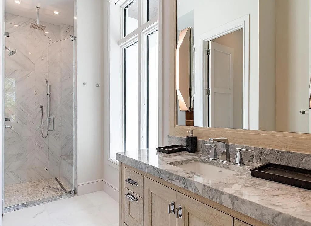This stunning house located at 2060 Gordon Drive, Naples, Florida, is now available for sale. The newly completed residence is part of a unique, gated beachfront enclave consisting of nine homes, making it a highly coveted property.