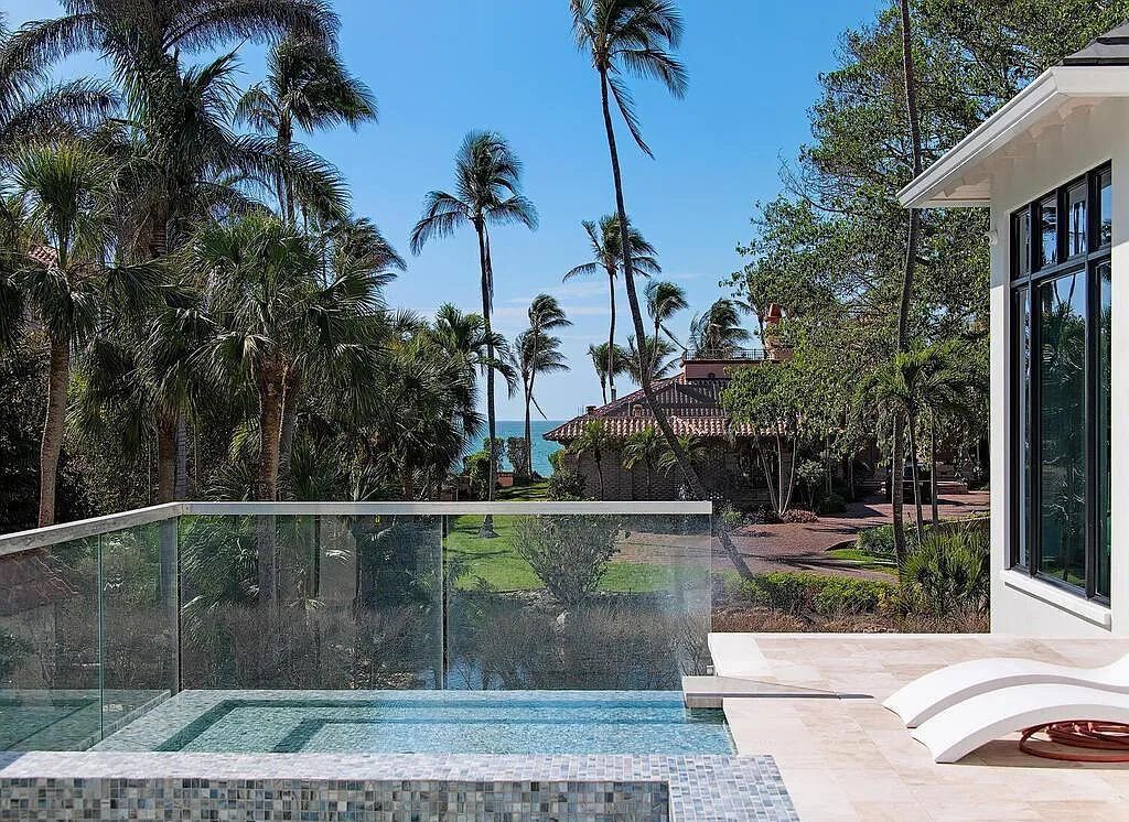 This stunning house located at 2060 Gordon Drive, Naples, Florida, is now available for sale. The newly completed residence is part of a unique, gated beachfront enclave consisting of nine homes, making it a highly coveted property.