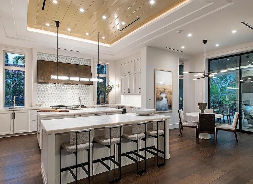This stunning house located at 2060 Gordon Drive, Naples, Florida, is now available for sale. The newly completed residence is part of a unique, gated beachfront enclave consisting of nine homes, making it a highly coveted property.