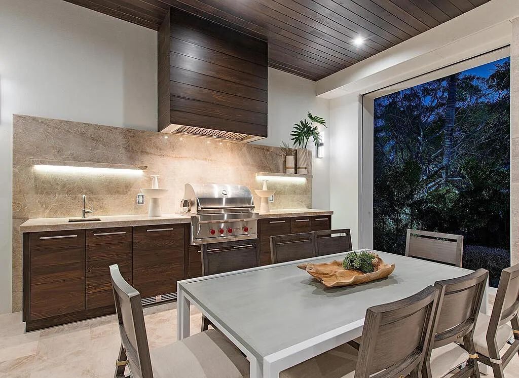 This stunning house located at 2060 Gordon Drive, Naples, Florida, is now available for sale. The newly completed residence is part of a unique, gated beachfront enclave consisting of nine homes, making it a highly coveted property.