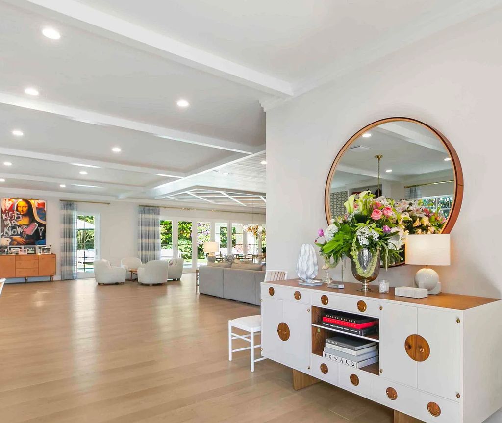 This luxurious 5-bedroom, 6.5-bathroom pool home is located in the Equestrian Club Estates in 14310 Calypso Lane, Wellington, Florida. The house offers 7,173 square feet of living space on a spacious 0.49-acre lot. Built-in 2000, the property has been completely renovated with high-end finishes throughout.