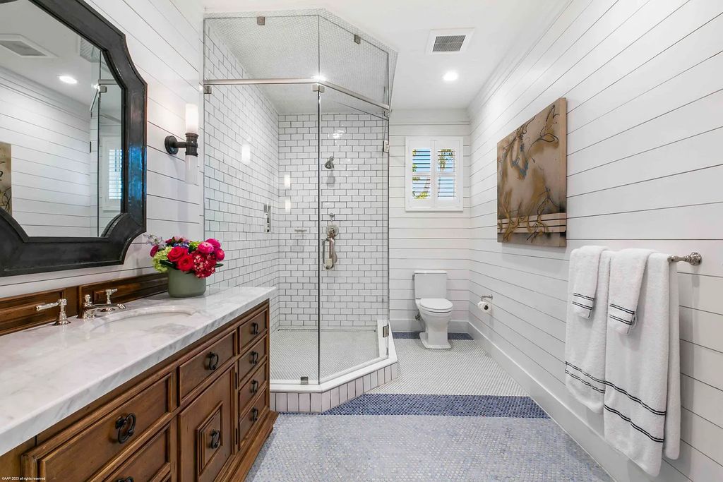 This luxurious 5-bedroom, 6.5-bathroom pool home is located in the Equestrian Club Estates in 14310 Calypso Lane, Wellington, Florida. The house offers 7,173 square feet of living space on a spacious 0.49-acre lot. Built-in 2000, the property has been completely renovated with high-end finishes throughout.