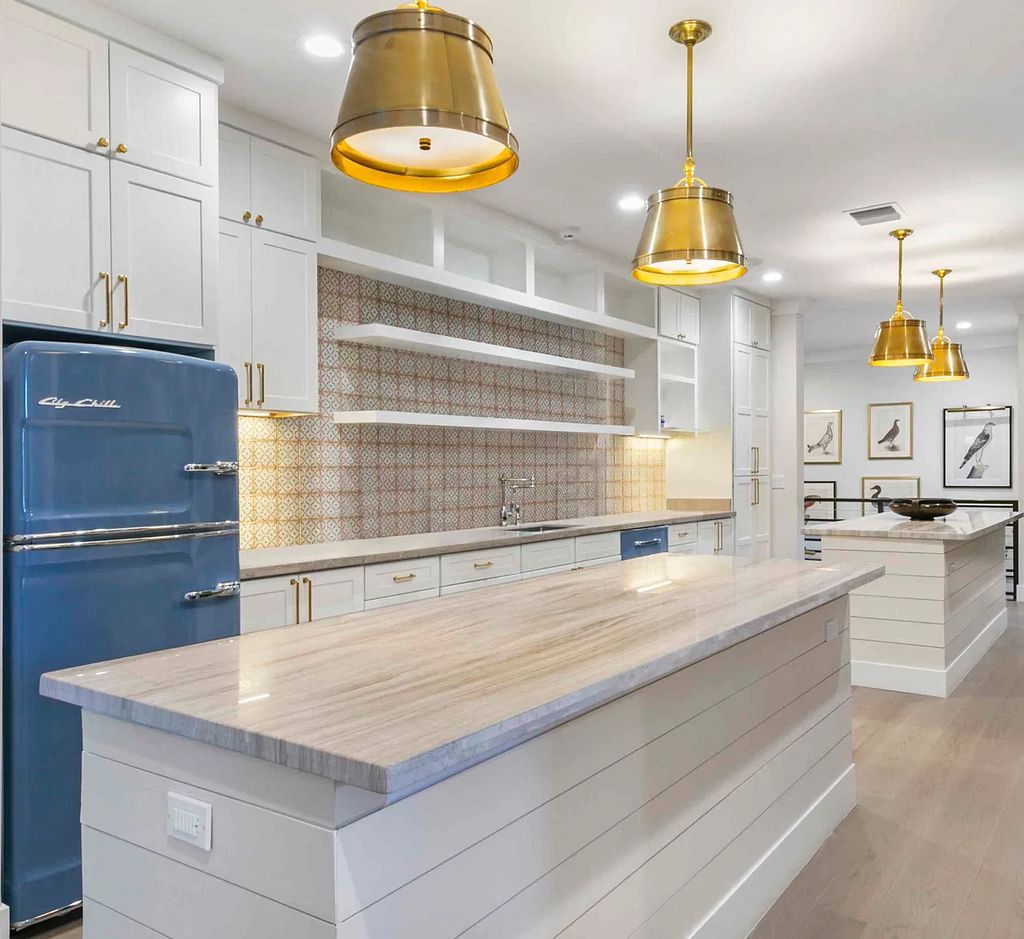 This luxurious 5-bedroom, 6.5-bathroom pool home is located in the Equestrian Club Estates in 14310 Calypso Lane, Wellington, Florida. The house offers 7,173 square feet of living space on a spacious 0.49-acre lot. Built-in 2000, the property has been completely renovated with high-end finishes throughout.