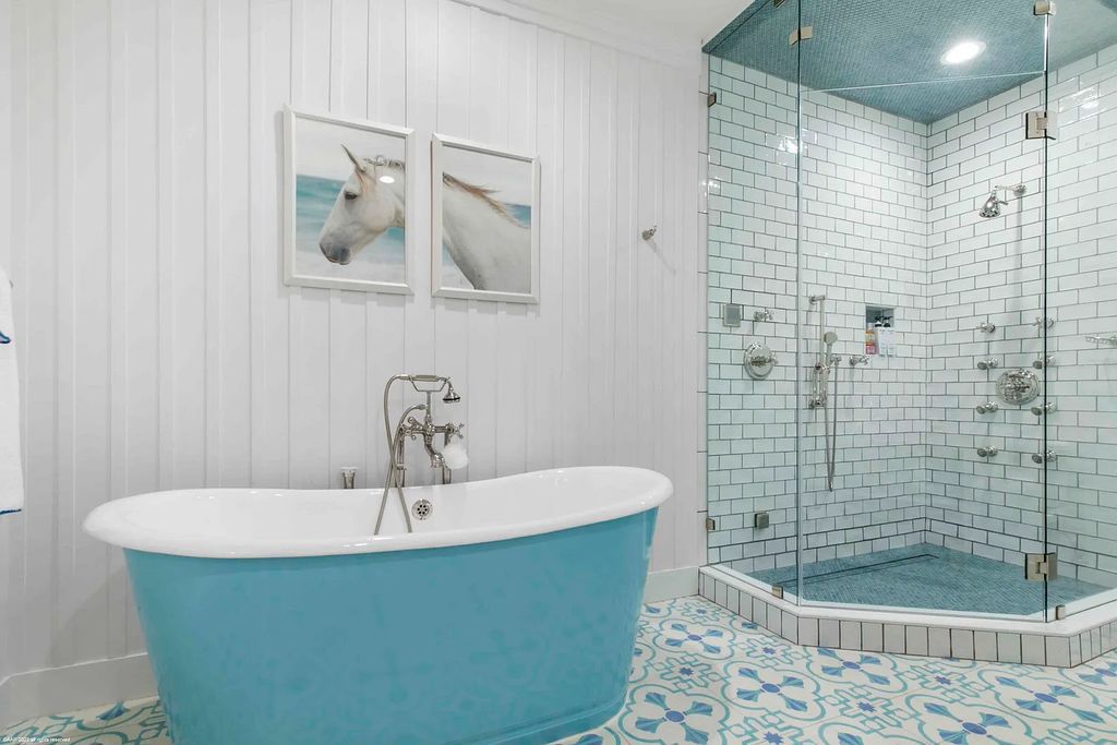 This luxurious 5-bedroom, 6.5-bathroom pool home is located in the Equestrian Club Estates in 14310 Calypso Lane, Wellington, Florida. The house offers 7,173 square feet of living space on a spacious 0.49-acre lot. Built-in 2000, the property has been completely renovated with high-end finishes throughout.