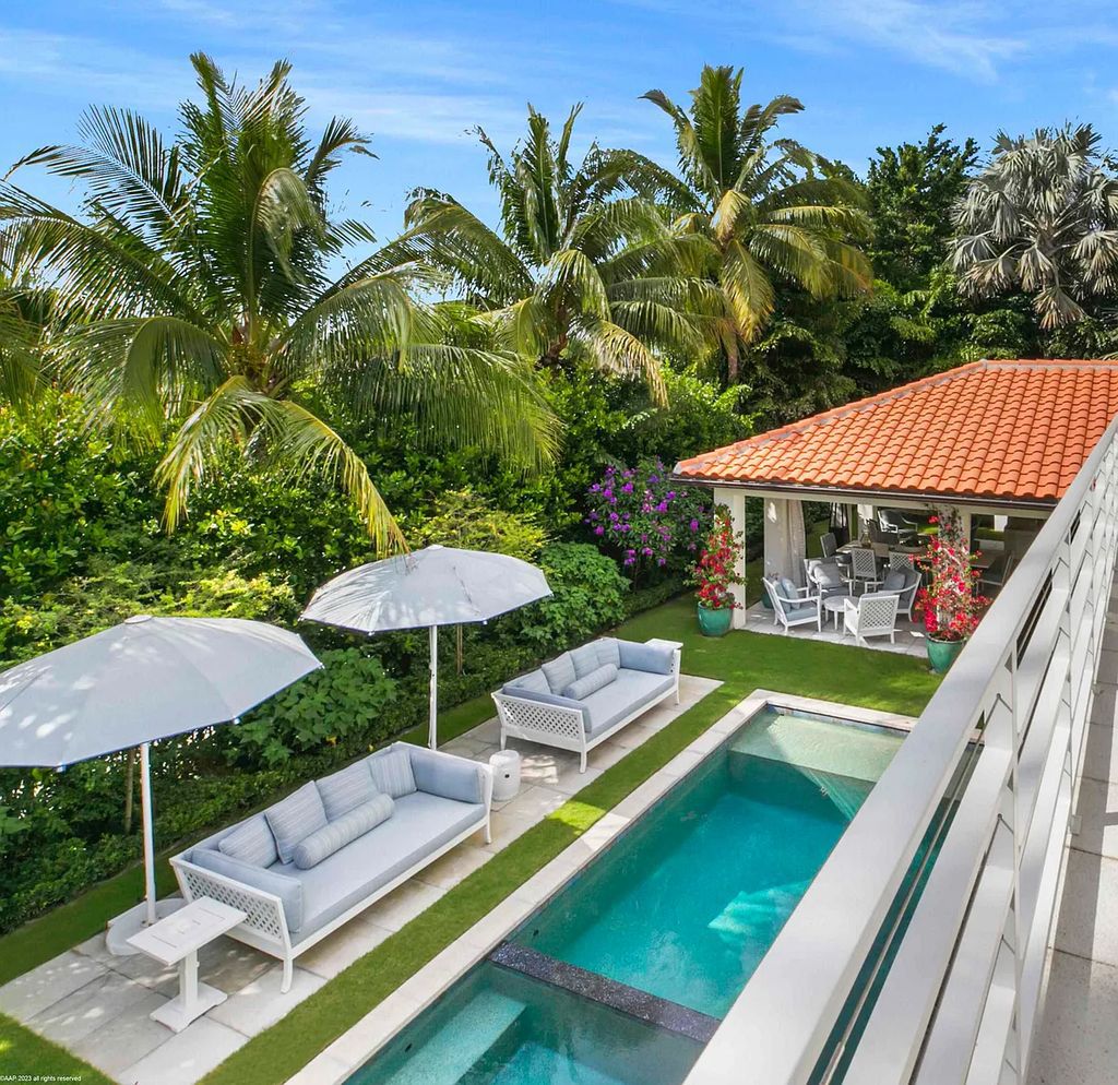 This luxurious 5-bedroom, 6.5-bathroom pool home is located in the Equestrian Club Estates in 14310 Calypso Lane, Wellington, Florida. The house offers 7,173 square feet of living space on a spacious 0.49-acre lot. Built-in 2000, the property has been completely renovated with high-end finishes throughout.